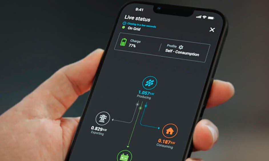 A technician using a smartphone app to monitor solar panel performance as part of aftercare services in Sandhurst