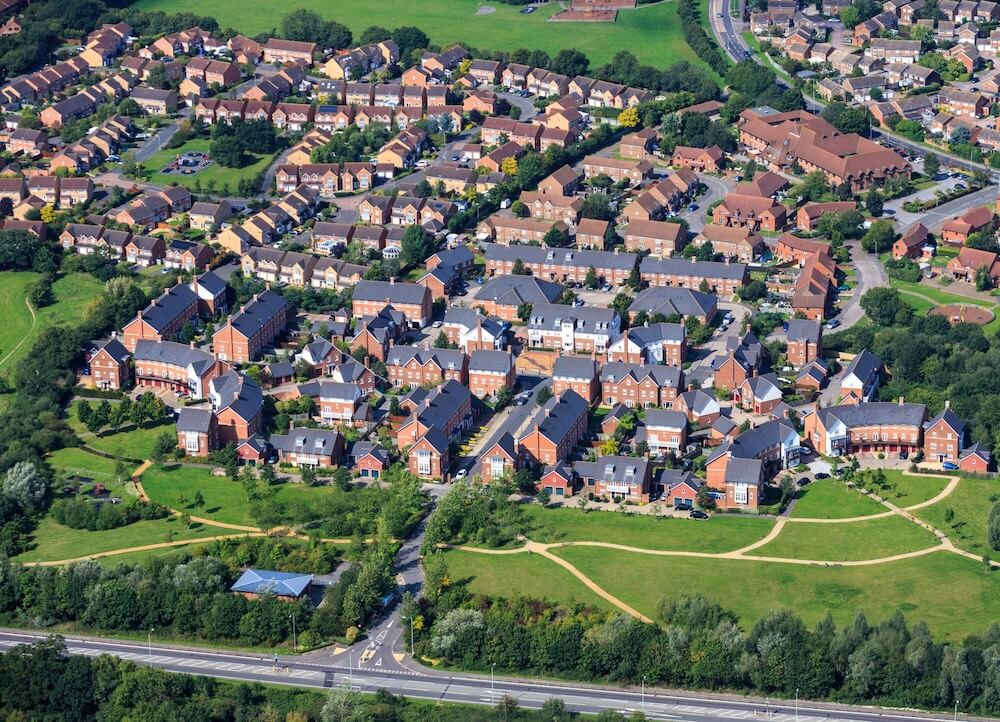 An aerial view of residential properties in Berkshire where solar panels can be fitted to rooftops, highlighting the county as an ideal location for solar installations