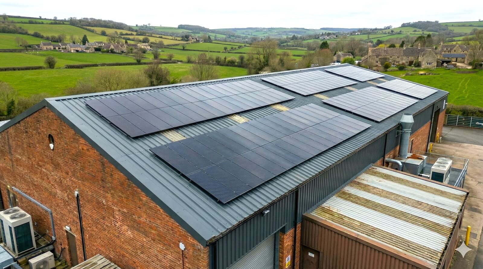 A commercial solar panel installation on the roof of a business premises in Berkshire