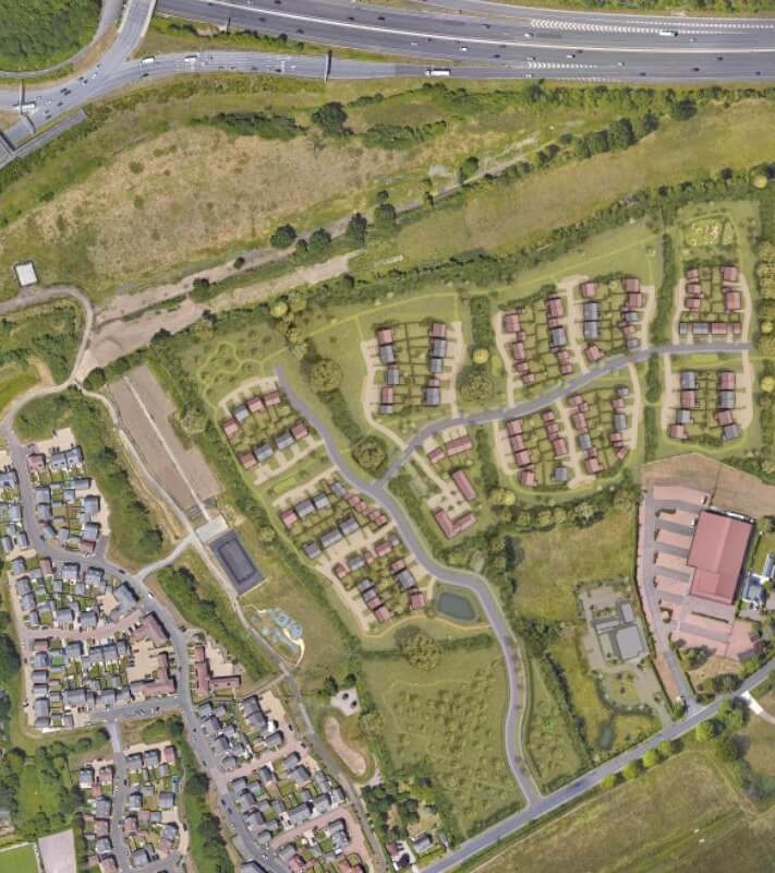 An aerial view of residential properties in Woodley, Berkshire, highlighting the town as an excellent location for solar panel installations
